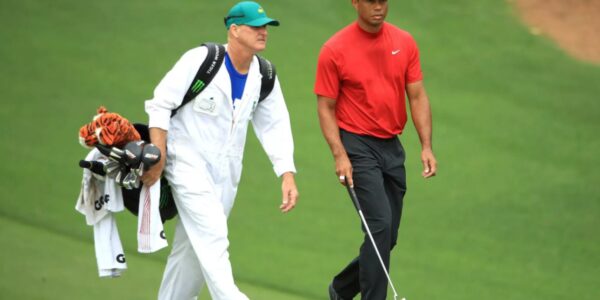 Man spends nearly $100,000 to caddy for Tiger Woods for one day