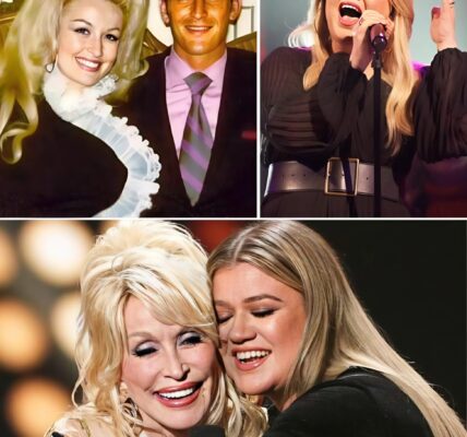 Just days after losing the love of her life, Carl Dean, Dolly Parton sat quietly in the audience — grief etched on her face, her heart visibly shattered. The world saw a legend, but in that moment, she was simply a woman in mourning. Then, Kelly Clarkson stepped onto the stage.