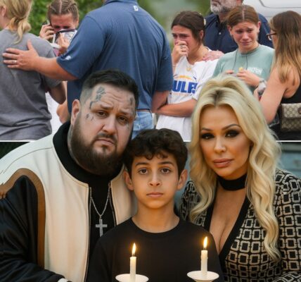 “I Don’t Have A Mommy Or Daddy Anymore…” — Those Were The Words That Broke Jelly Roll’s Heart The Moment He Met The Little Boy Standing Alone In The Aftermath Of The Texas Flood. No Home. No Family. Just A Child Clutching A Water-Soaked Teddy Bear In Silence. What could’ve been the end of his story… became a miracle no one saw coming. Jelly Roll and his wife Bunnie X.O., known for their fierce love and big hearts, didn’t just offer comfort. They offered forever. In a quiet courthouse filled with tears, they adopted him—not out of charity, but out of pure, unstoppable love. “He doesn’t need pity,” Jelly whispered, holding the boy close. “He needs a place to be loved. And that’s us.” From tragedy rose something stronger than loss: family. And in the wreckage of everything he knew, that little boy found something new… A hand to hold. A place to belong. And a love that won’t let go.