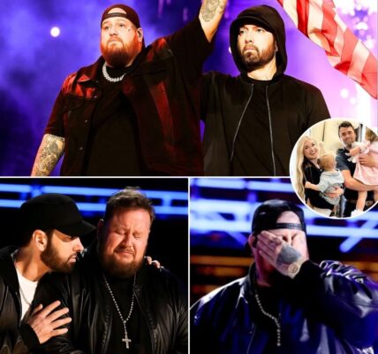 “Charlie Kirk Has Been Laid to Rest… But What About His Daughters? I Can’t Stop My Heart From Breaking” — Jelly Roll and Eminem Collapse in Tears on Stage as 25,000 Fans Fall Silent in a Once-in-a-Lifetime 9/11 Tribute That Stopped the Music, Froze a Stadium, and Erupted Into a Roar of Song, Flags, and United Grief Across America! “Charlie Kirk has been laid to rest… but what about his daughters? I can’t stop my heart from breaking,” Jelly Roll’s trembling voice rang out into the night, his words catching in his throat as Eminem, standing beside him, wiped away tears he could no longer hide. The crowd of more than 25,000 fell into stunned silence — no instruments, no applause, no sound but the shared weight of loss hanging over the stadium like a heavy cloud. For a full minute, the lights glowed dim, fans held hands, bowed heads, and some wept openly. What began as a concert transformed into something sacred: a vigil for a fallen father, a national wound, and the innocent lives taken on 9/11. And then — out of the silence — Jelly Roll’s voice cracked into “God Bless America.” Eminem, breaking into song with him, lifted the anthem higher, until the entire stadium became a tidal wave of voices. Flags rose, faces shone with tears, and grief collided with defiance. What began as stillness became thunder — a wall of sound that could be heard for miles, a roar of unity against loss, pain, and fear. Clips of the moment exploded online, with millions calling it “the silence that shook America”, “a prayer set to music,” and “the most powerful tribute of our time.” This was no longer a concert. It was a collective outcry, a living memorial, and a promise that even in the darkest of nights, America’s spirit will not be broken.