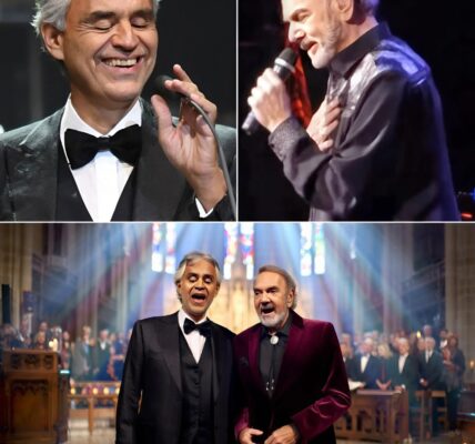 Andrea Bocelli and Neil Diamond stunned the world with a once-in-a-lifetime duet inside a gothic cathedral, beneath stained glass windows glowing in candlelight, their voices blending like a prayer more than a performance; Bocelli stood in classic black tuxedo radiating elegance, while Diamond shone in a burgundy velvet blazer with silver bolo tie, their harmony so moving that the audience sat frozen in awe before erupting into thunderous applause, calling it not just a concert but a glimpse of heaven itself.